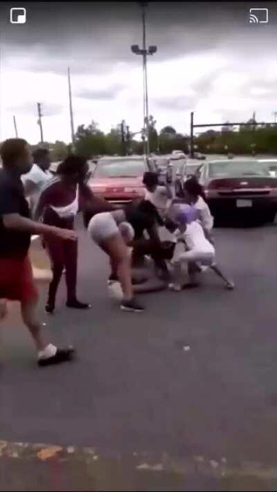 Young children help their mother jump a woman