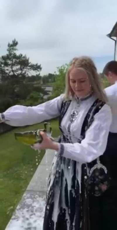 Trying to open the bottle with a knife