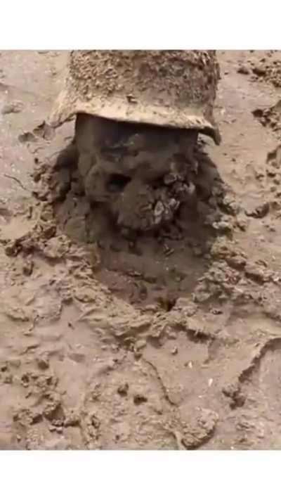 As the Kakhovka Dam dries out the remains of WW2 German soldiers are being found