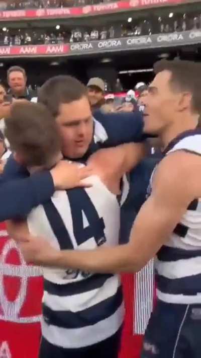 Celebrating their win with waterguy who has down syndrome