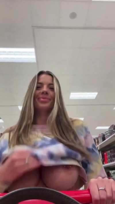 Shopping. Pierced huge tit reveal while shopping..