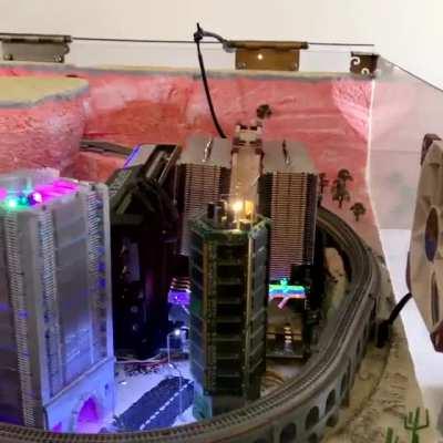 The Micro City PC includes a Z scale model train running inside the case of a working system. The train and the city lights are powered as peripherals by the PSU.