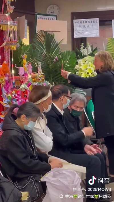 White woman very interested in Chinese funeral offerings