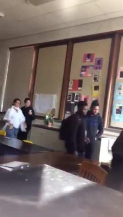 Student hits teacher by accident during fight