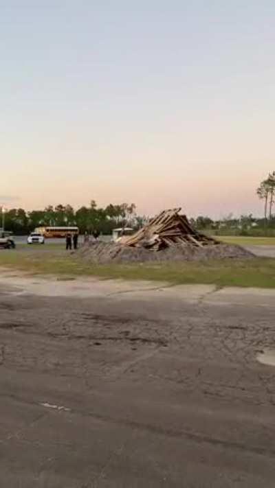 Simply igniting a mundane bonfire for a school event.