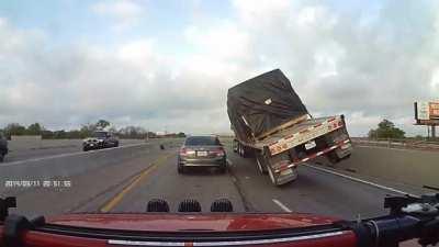 Trucker negotiates a curve with heavy load