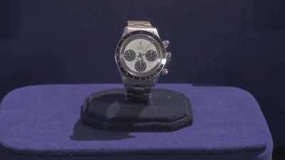 Vietnam veteran being told how much his Rolex watch is worth