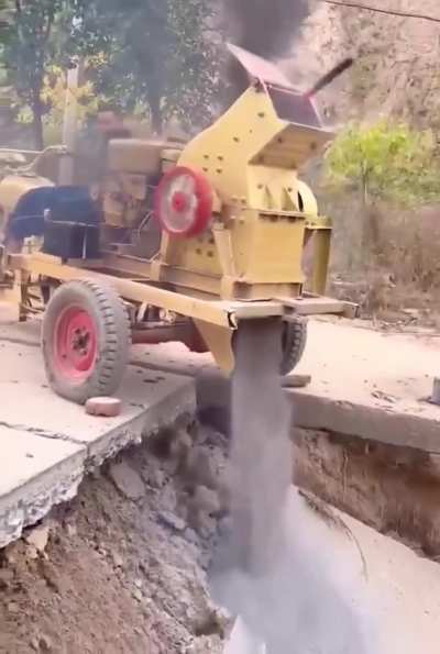 WCGW while trying to shatter the bricks stuck in the stone crusher with a hammer.