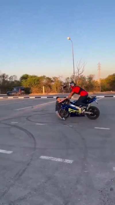 WCGW popping a wheelie with someone on the front of the bike