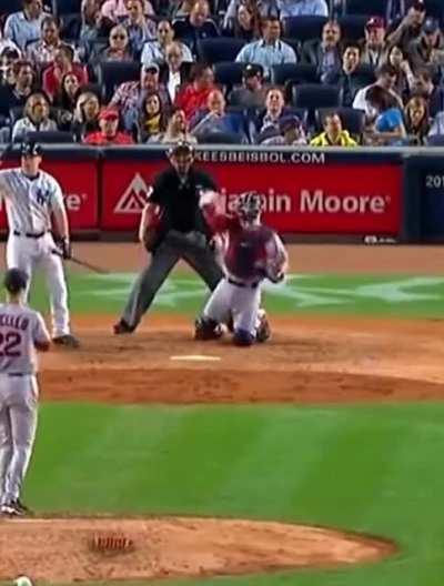 Guy tries to catch the ball at a baseball game