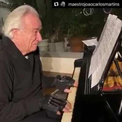 Wholesome moment: Brazilian maestro João Carlos Martins uses bionic gloves to play the piano after 22 years. He's lost movement of his fingers after two accidents and 24 surgeries.