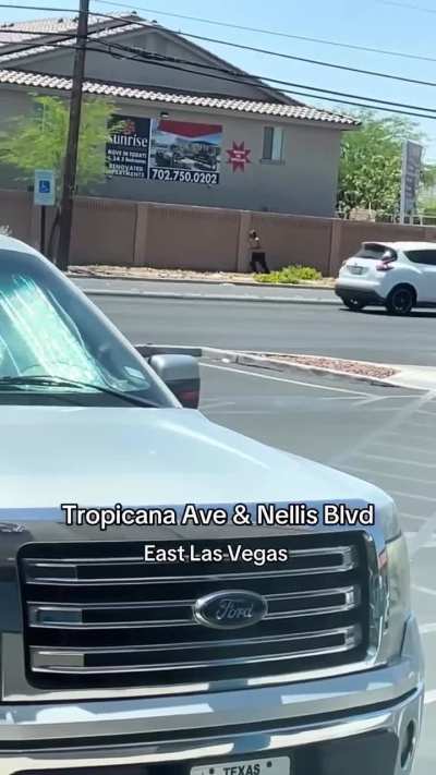 Street Justice on Tropicana and Nellis.  Idiot is Throwing Stones at Cars.