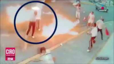 Fire eater tries to steal money from mariachi band, the musicians resist and the fire eater sets them in flames in Michoacan, Mexico