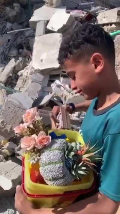 Video from Instagram about a child from Gaza save his flowers after Israelian army bombed his house