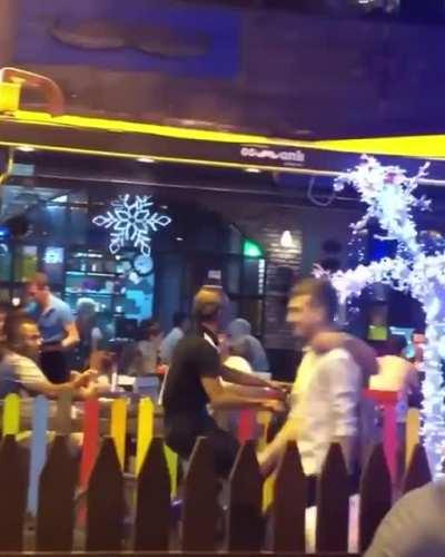 This guy is drinking tea while riding the bike