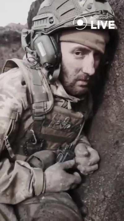 Ukrainian soldier wakes up comrade who slept in the trench. His face says everything. 