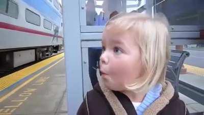Little girl sees train for the first time.