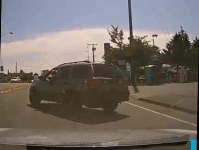 Dashcam footage shows a disturbing incident of road rage in King County, Washington, in which a man hurls a hammer through another driver's window. The assailant was arrested for multiple felonies three days after the incident.