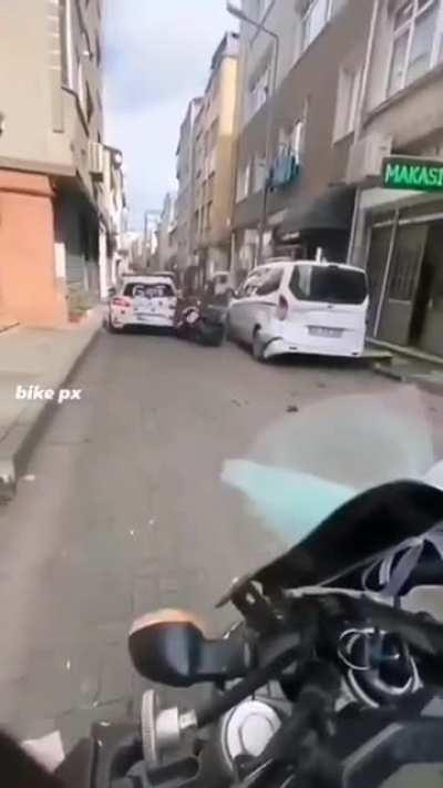 WCGW trying to pop a wheelie in a narrow alley