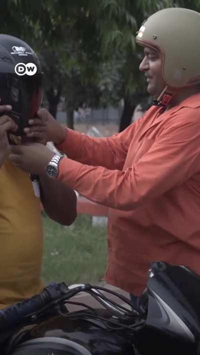 'The Helmet Man' offers free helmets on India's roads after his friend died in an accident