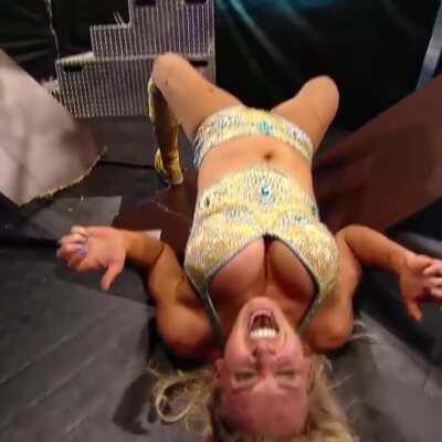 Charlotte and her giant tits writhing in pain after going through a table