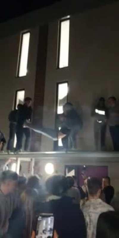 Students throwing their mates off the ledge at University
