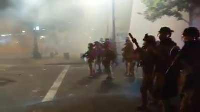A scene straight out of a dystopian movie from the Portland protests. Federal officers advance as they shoot at and gas protestors.