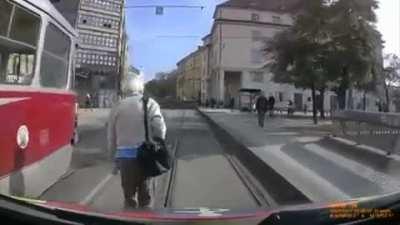 Pedestrian blocks and flips off an ambulance transporting patient with severe breathing problems