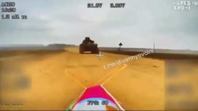 Russian fiber optic drone waiting on a road flies into the path of an approaching ATV in early 2025