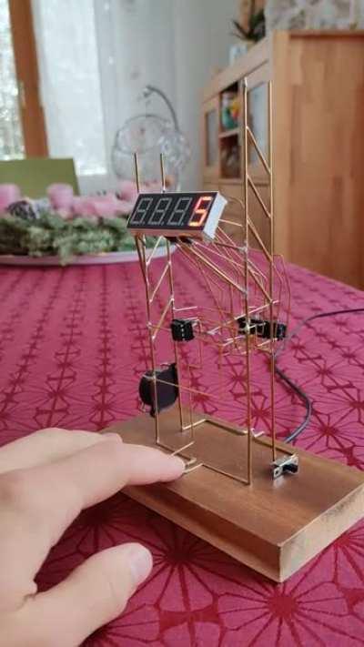 I made a freeform circuit counter for my dad to support him on his goal to quit smoking. One button press for one day without a cigarette.