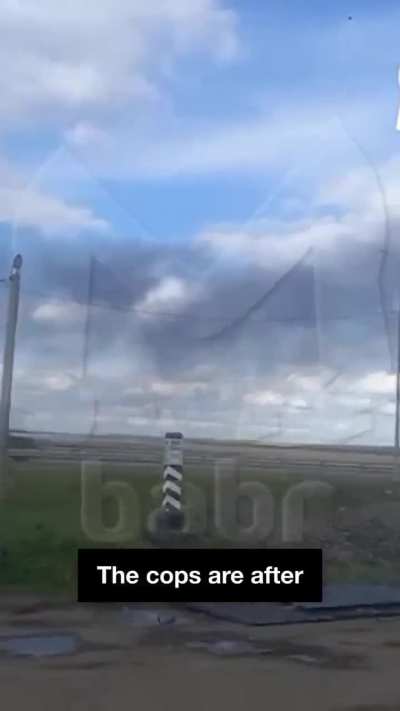 A Russian bystander reacts to Ukrainian drones emerging from trucks