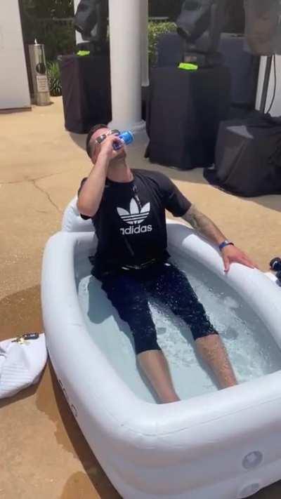 JJ being a man of his word, shotguns a Bud Light.