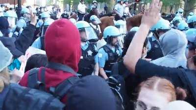 Chicago protestors attempt to place barrier between themselves and CPD, officer yanks barrier away hitting multiple protestors in the head