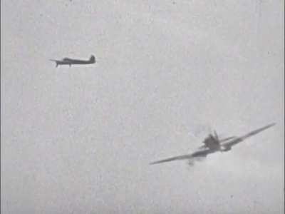 Jagdgeschwader 53 Bf 109 F forces an RAF Spitfire Mk Vb to break off its attack on a Junkers Ju 88 bomber near the Maltese coast in early 1942