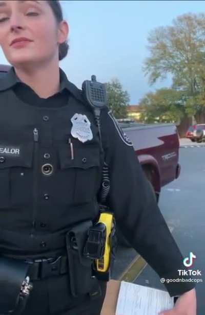 What is she pointing at?