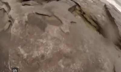 WCGW standing by the ocean in a lightning storm