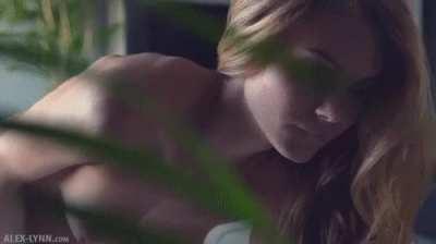 undressing and pleasuring herself