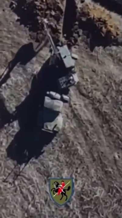 Russian tractor digging trenches is hit by 2 Ukrainian drone dropped grenades (date/location unknown)