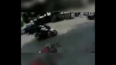 Reckless speeding motorcyclist takes his eyes off the road to give the finger to rider who 'cut him off' and ends up ramming himself into the back of a city bus.