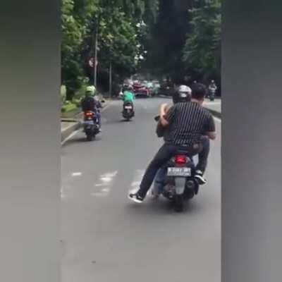 Grabs a stranger for the chase with the rest in tow.