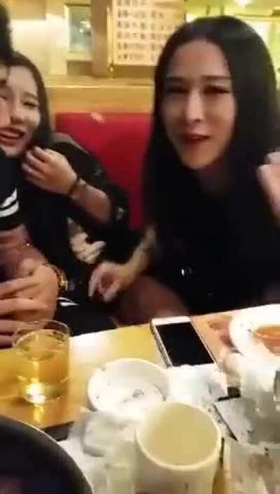 Cute chinese shemale help stroking other shemale in a restaurant [GIF]