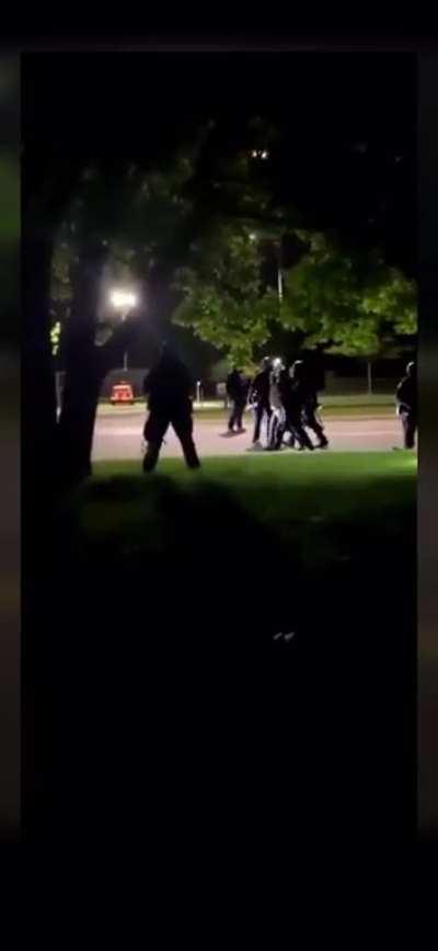 Fully armed police protecting George Floyd’s killers house attack unarmed peaceful protester who was filming them