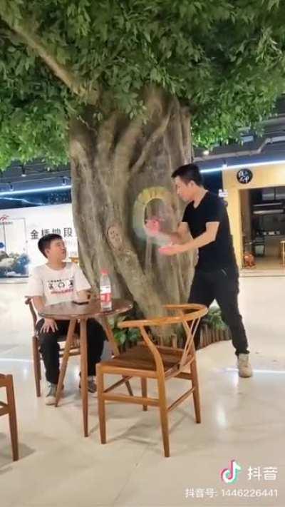 Slinking around a water bottle, then knocking it over