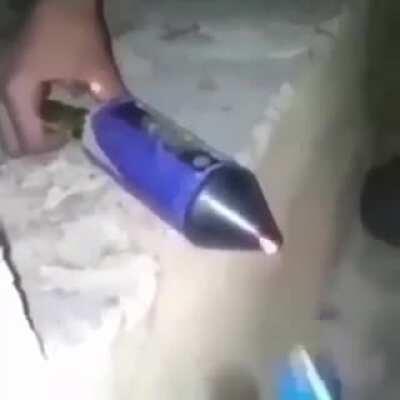 lighting a firework from the front
