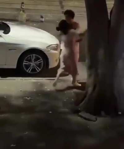 Dude let's woman slap him twice but knocks her out when she touches his car.