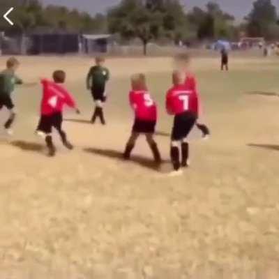 To kick the ball.
