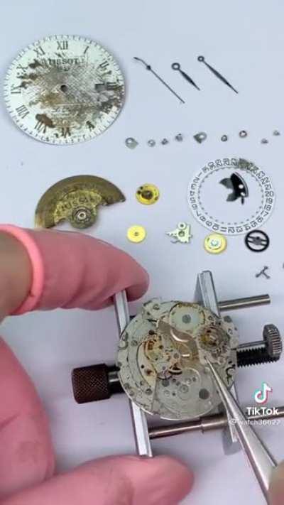 Guy fixes broken watch.