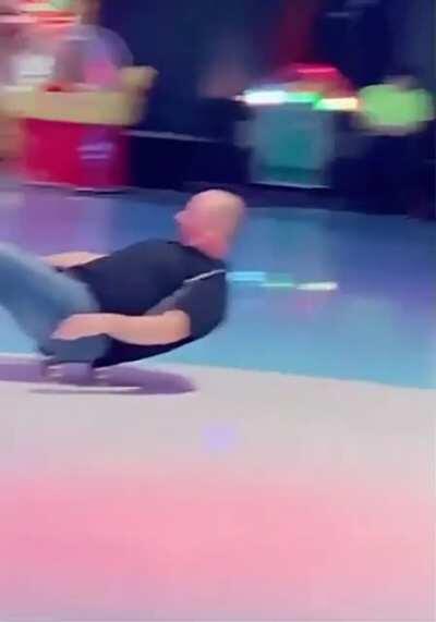 Dad shows his neat skating trick