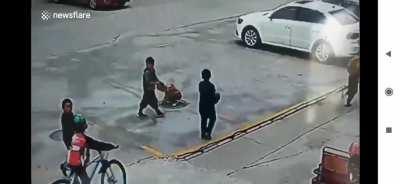 Kid gets yeeted after throwing a firecracker into manhole