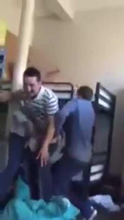 Guy attempts to put on jeans by jumping into them.